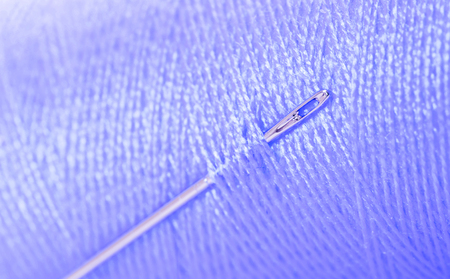 Purple threat with needle, full frame, focus on needleの写真素材