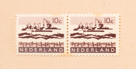 THE NETHERLANDS 1970: A stamp printed in the Netherlands shows the construction of the afsluitdijk, circa 1970のeditorial素材