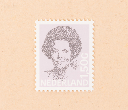 THE NETHERLANDS 1990: A stamp printed in the Netherlands shows queen Beatrix, circa 1990のeditorial素材