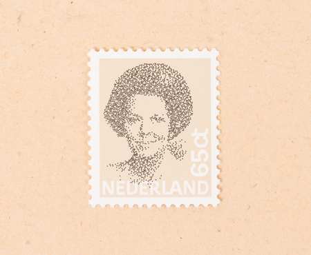 THE NETHERLANDS 1990: A stamp printed in the Netherlands shows queen Beatrix, circa 1990のeditorial素材