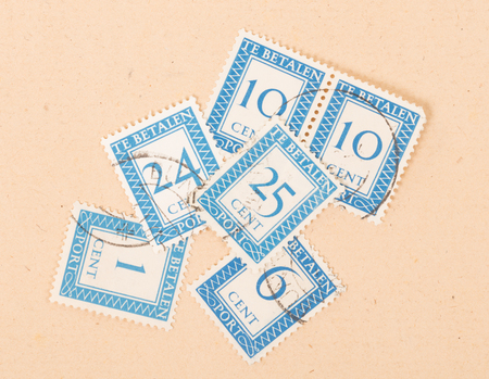 THE NETHERLANDS 1950: Stamps printed in the Netherlands showing their value, circa 1950のeditorial素材