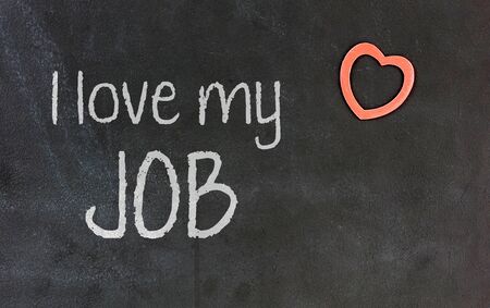 Blackboard with small red heart in the corner - I love my jobの写真素材