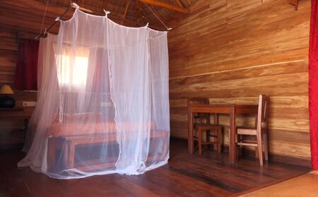 Mosquito net on the bed, to protect tourists while sleepingの写真素材