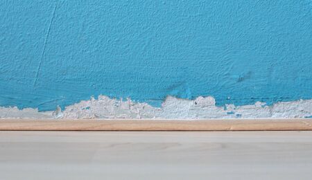 Old peeled wall with mold, blue wall