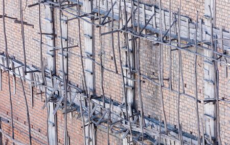 Wood scaffolding for construct a building under construction, Madagascar