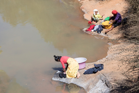 Ranomafana, Madagascar on july 25, 2019 - Local people doing the laundry in the river in Ranomafana, Madagascar on july 25, 2019のeditorial素材