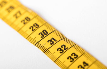 Measuring tape isolated on white, selective focus on 31の写真素材
