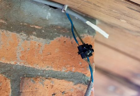 Unsafe electronic connection outside a building on Madagascar, Africa