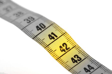 Measuring tape isolated on white, selective focus on 42の写真素材