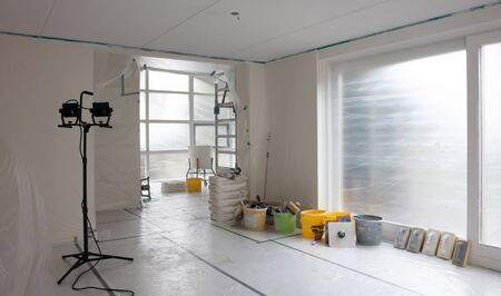 Interior prepared for plastering, eventything covered in plastic, construction LED lightの写真素材