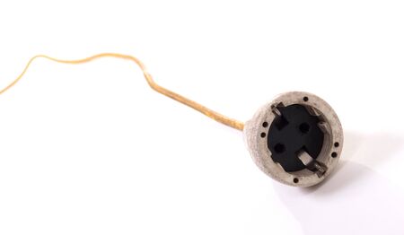 Extension cord, old and probably not safe anymore, isolated on whiteの写真素材