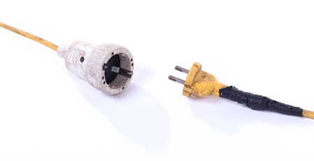 Extension cord, old and probably not safe anymore, isolated on white