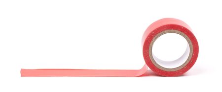 Roll of red insulation tape isolated on white backgroundの写真素材