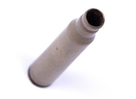 Isolated macro shot of M-16 5. 56mm cartridge, isolated on white