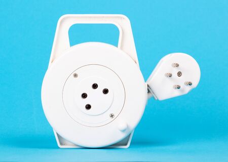 Retractable phone cord isolated on blue background