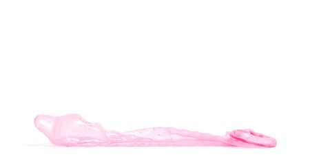 Red condom, isolated on a white backgroundの写真素材