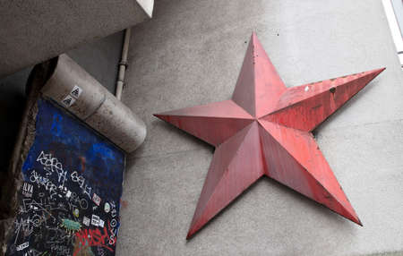 Berlin, Germany on December 30, 2019: Part of the Berlin wall and red star near Checkpoint Charlie between east and west sectors during the Cold War. Berlin, Germanyのeditorial素材