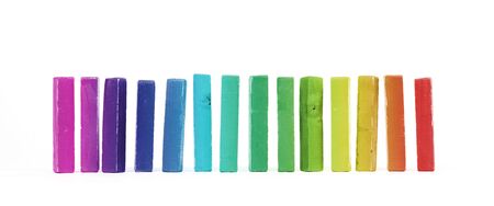 Row of vintage building blocks isolated on white background - Rainbow colored