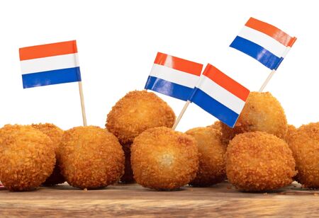 Dutch traditional snack bitterbal on a serving board, dutch flag, isolatedの写真素材