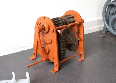 Old vintage metal winch standing on the ground