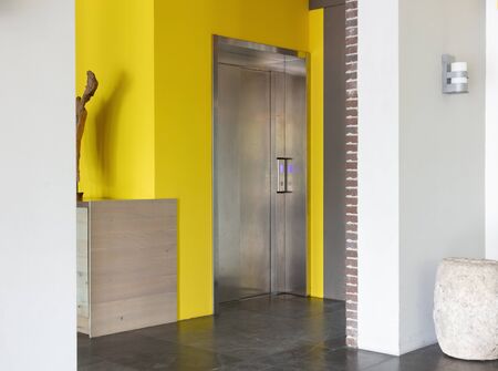Single elevator door inside a modern building