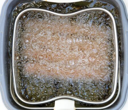 Frikadellen, a Dutch fast food snack in the oil, selective focusの写真素材