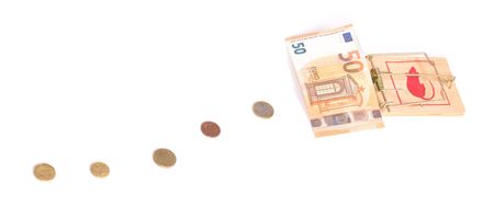 Money on the mousetrap, isolated on whiteの写真素材