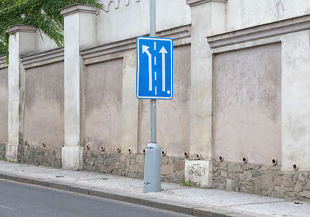 Appropriate traffic lanes at crossroads junction, blue signの写真素材