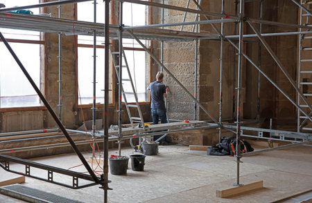 Prague, Czech Republic on July 8, 2020: Worker renovating a part of the Prague castle