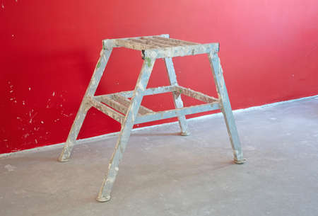 Small metal ladder, very dirty, intensively usedの写真素材