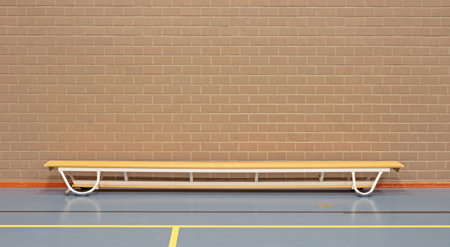 Empty wooden bench in school gym, wood and metal