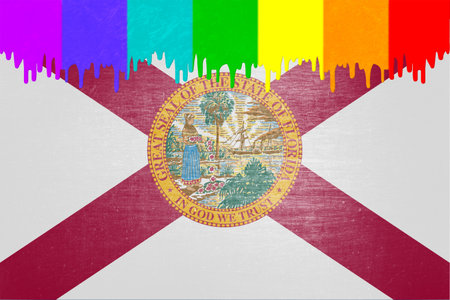 Paint (in the colors of the rainbow flag) is dripping over the state flag of Floridaの写真素材
