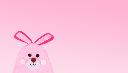 Rabbit, bunny made of bright fabric on a pink backgroundの写真素材
