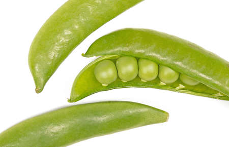 Close up of fresh green sugar snap peas , isolated on whiteの写真素材
