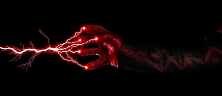 Hand shooting out a bolt of lightning - Dark and mysterious, isolated on blackの写真素材