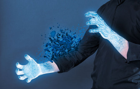Frozen hands with cold stone shattering - Concept of power
