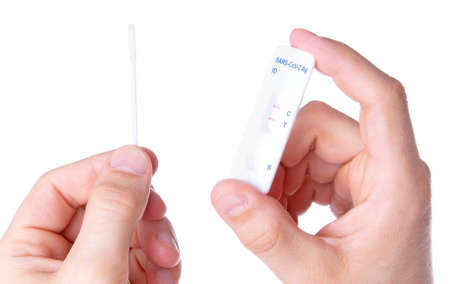 Rapid covid-19 strip test isolated on white - Positive tested