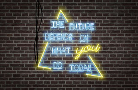 Bright neon lights on a wall - The future depends on what you do todayの写真素材