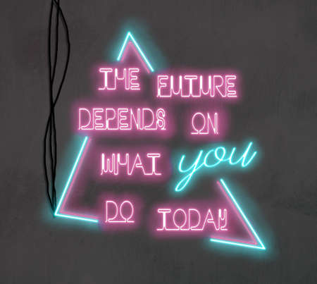 Bright neon lights on a wall - The future depends on what you do todayの写真素材