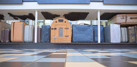Old luggage and suit cases waiting to be checked in, selective focusの写真素材