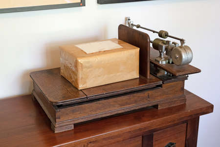 Very old scales made out of wood, package on itの写真素材
