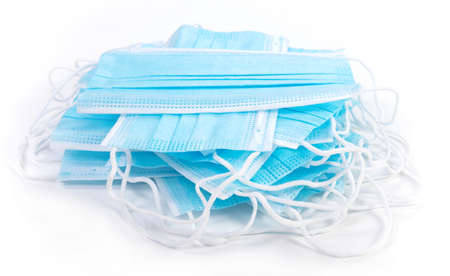 Pile of protective medical face masks, isolatedの写真素材