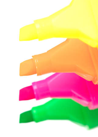 Colorful highlighter markers in various colors isolated over a white backgroundの写真素材