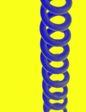 Old dirty blue telephone cord (vintage), isolatedの写真素材