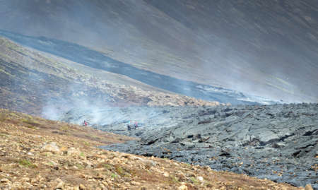 Grindavik, Iceland - July 26, 2021: A unique natural attraction. People are walking over the new...