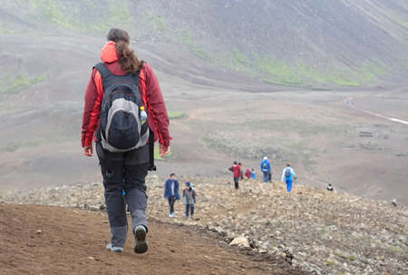 Woman walking near the new lavafield of the volcano eruption at Fagradalsfjall, Icelandの写真素材