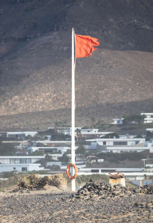 Red flag warning on beach in Spain (Lanzarote)の写真素材