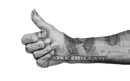 Old woman with arthritis giving the thumbs up sign, one dollar wrap, isolated on whiteの写真素材