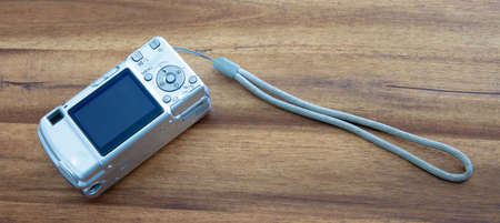 Old digital camera isolated, obsolete and not in use anymore, dusty and dirtyの写真素材