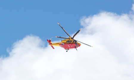 Glacier Paradise, Switzerland on July 19, 2020: Yellow rescue helicopter near the Swiss Matterhornのeditorial素材